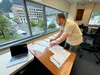Brian Jackson, election program manager for the Alaska Division of Elections, demonstrates on Friday, Sept. 20, 2024, how a hand-count process would work for Alaska's presidential election. J