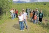 ROBERT DeBERRY/Frontiersman Bonnie and Dave Zirkle, center,
stand with other Wishbone Hill neighborhood residents at the edge
of Jeff and Jen Young’s property off Buffalo Mine Road. The area 