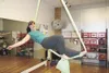 Krista Gray lounges in a ‘Cupid’s bow’ formation from hanging
silks from the ceiling of her studio in Wasilla. Along with
business partner Tony Glaser, the pair operate Glacier Dietary
Foods 