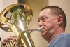 Steve Vonda practices with the Mat-Su Concert Band Monday evening at Teeland Middle School. The band will perform its holiday concert at 7:30 p.m., Friday at Teeland. ROBERT DeBERRY/Frontiers