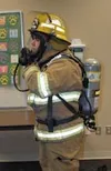 Luke Szipszky tests out a new self-contained breathing apparatus
like those that will be purchased through a nearly $390,000 grant
recently received by Central Mat-Su Fire Department. Photo b