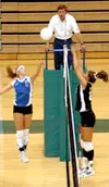 Palmer outside hitter Jessie Macknicki tries to tip the ball
past Colony middle hitter Kristina Klapperich during the third game
of Colony's 3-2 win over Palmer at Colony High School on Tuesd