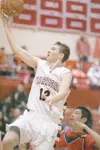 ROBERT DeBERRY/Frontiersman Wasilla forward Brayden Kuiper goes
to the basket during Friday’s game against the North Pole Patriots
at Wasilla High School.