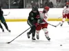 Colony's Simeon Adams and Wasilla's Matthew DeMaster collide as they chase the puck during Wasilla's 6-3 win over Colony at the Brett Memorial Arena. Bruce Eggleston/matsusports.net