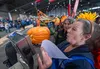 Crops Superintendent for Alaska State Fair Kathy Liska and Sarah Sperry, Weights and Measures Inspector, check the scale for the winning pumpkin weight during the 2024 Alaska State Fair. J. D
