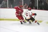 Wasilla forward Alex Clark tries to move the puck away from West Valley's Logan Arpino during a 5-1 loss to the Wolfpack in the 4A state semifinals. Courtesy of MatSuSports.net