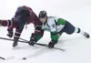 ROBERT DeBERRY/Frontiersman Fairbanks Ice Dog Logan Wendling
collides with Avalanche forward Gage Christianson during Friday’s
game at the MTA Events Center in Palmer. Robert DeBerry
