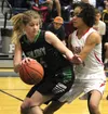 Colony sophomore Alex Carlton tries to get past Wasilla freshman Olivia Davies during the Northern Lights Conference title game March 12 at Palmer High. Wasilla beat Colony 49-35 to win the c