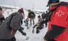 Ski patrol instructor Nathan Vertel shows students Hunter Owen, Baeli Thorpe, Taylor Finkenbinder and Tori Moma how to use an avalanche transceiver to find buried victims. J. David McChesney/