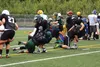 A couple of Colony High School football players take tackles during an exercise at the All Alaska Football Camp XXIV Friday morning at Colony High School. The camp has been held in the Mat-Su