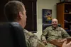 Col. Matthew Nicholson, 36th Wing vice commander, talk with Maj. Gen. Lee Tafanelli, Kansas Adjutant General, Kansas Homland Security and Emergency Management director, during a visit to Ande