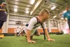 Keahi Wolf fights to power past the line during a football skills drill Thursday at the Mat-Su Sea Hawkers Play 60 Challenge at the AT&amp;T Sports Center. ROBERT DeBERRY/Frontiersman.com
