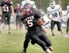 Houston's Waylon Soptick runs for a first down during a recent game against the Valdez Buccaneers at Houston High School ROBERT DeBERRY/Frontiersman.com