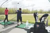 Sean Fields and Rommel Reyes practice their golf swings at Moose Run Golf Course driving range at Joint Base Elmendorf-Richardson, Alaska, May 21, 2018. Both Fields and Reyes have been using 