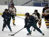 Mat-Su's Aliana Burnside moves the puck across the ice against Dimond-West. Bruce Eggleston/matsusports.net