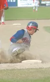 JD Mayo slides into third base while playing for the Alaska Road Warriors. The former Colony High School standout returns to the Valley baseball scene as a member of the Mat-Su Miners. ROBERT