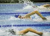 Palmer swimmer Katie Stark swims to a new school record of 54.64 seconds in the 100 yard freestyle Saturday at the Valley Invitational swim meet at palmer High School. ROBERT DeBERRY/Frontier