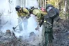 Members of the Gannett Glacier Crew work to contain a wildfire. Courtesy of Mike McMillan