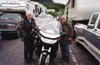 Leonard and Barb Tillman take a break from one of their many
motorcycle trips down the Alcan Highway. At 77, Barb Tillman once
had a sign on the back of her motorcycle that read, "I'm a littl