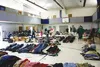 Volunteers organize donated clothes at Wasilla Lake Church of the Nazarene in preparation for the annual Community Clothing Giveaway tomorrow as part of the Valley Pastors Prayer Network's Re
