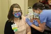 Dr. Anne Zink gives the COVID-19 vaccine to Kara Cahill at Mat-Su Regional Medical Center Friday. Tim Rockey/Frontiersman