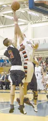 Wasilla junior John Knowles slams the ball into the basket during the Warriors’ 60-42 win over Kenai. DEREK CLARKSTON/Kodiak Daily Mirror
