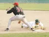 ROBERT DeBERRY/Frontiersman Mat-Su Miner Jonathan Johnson dives
back to first base during the third inning of Monday's game against
the Peninsula Oilers.