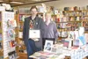 Will Elliott/Frontiersman Owners David Cheezem and Melissa
Behnke pose in Fireside Books of Palmer with their Spirit of Youth
Youth Friendly Business Award.