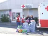 ANNETTE HAKKENEN/Courtesy photo Red Cross volunteers Victor Hett
and Bill Morrow, along with two employees from Wal-Mart in Kenai,
help support firefighters during the Caribou fire last summe