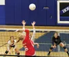 Wasilla middle hitter Olivia Vincent smacks the ball over the net during a 3-2 win over Palmer Sept. 29 at Palmer High School. Vincent finished with 11 kills and six blocks in the match. JERE
