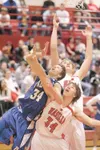 ROBERT DeBERRY/Frontiersman Palmer's Bryce Jacobson goes up
against Wasilla's Shane Green and John Knowles for the rebound
during Wednesday's game at Wasilla High School.