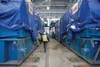 Tony Zellers, Director of the Eklutna Generation Station Project, walks between two of the 19 foot tall, 65 foot wide, 390 ton Wartsila engines. The new generation station will house 10 engin