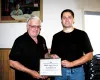 Palmer Fire Chief Dan Contini, left, spoke kind words about 2003
Hero Award recipient Todd Russell at the Greater Palmer Chamber of
Commerce luncheon meeting this week. Russell, who was injur