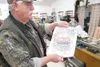Conrad Holler holds a drawing for his new soup kitchen. He plans
to name the place Tater’s Café. ROBERT DeBERRY/Frontiersman