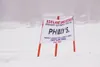 Signage along an ice road on Big Lake advertises a local cafe during Iron Dog and Winterfest 2014. Spring ice conditions are deteriorating rapidly and people are remind to stay off the ice, a