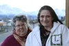 Connect Palmer director Sherry Carrington and client Terri Davis smile for a photo on the balcony of Sarah's House, an apartment above the nonprofit's office that is rented to program partici