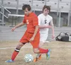 Wasilla senior Travis Patterson, left, tries to keep the ball away from Colony junior Jake Spannagel during the Knights’ 2-0 win over the Warriors at Colony High on Monday. Spannagel scored a