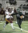 Colony senior quarterback Steven Bilafer tries to get away from Dimond defensive lineman Brandon Pili during Dimond's 34-26 playoff win over the Knights Oct. 9 at Colony High School. Courtesy