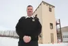 Palmer Fire Chief John McNutt stands in front of the fire training center in Palmer. McNutt is being deployed for six months with the Air National Guard. ROBERT DeBERRY/Frontiersman.com