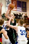 Colony senior guard Damien Fulp shoots for two points as Palmer’s Adam Ramoth reaches for a block during the Knights win over Palmer Saturday at Palmer High School. ROBERT DeBERRY/Frontiersma