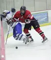 ROBERT DeBERRY/Frontiersman Palmer junior Dylan Danielowski
takes a hit from behind that send him into the board which ended
his night on the ice. He will not return for tomorrow's game
again