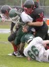JEREMIAH BARTZ/Frontiersman Houston junior Greg Necas tackles a
Delta Husky for a loss during the Hawks’ 53-6 win over the Huskies
at Houston High School on Saturday.