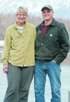 Jean and Harry Holt stand on a dock near their home on Finger Lake. ROBERT DeBERRY/Frontiersman.com