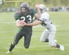 ROBERT DEBERRY/Frontiersman Colony senior Ben McGraw runs for a
gain in a game against Soldotna during his senior season. The
5-foot-11, 210-pound standout played on both offense and defense
