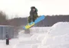 Ezekiel Turecki grabs the edge of his snowboard as he catches
some air off a jump during a practice session near the skate park
in Wasilla. (ROBERT DeBERRY/Frontiersman) Robert DeBerry