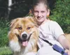 Bridgette Lewellyn and the family's dog, Bear, sit outside the
Lewellyn's Wasilla home. Bear was scheduled to be euthanized after
killing a neighbor's cat, but the Wasilla City Council change
