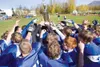 The Palmer Moose varsity football squad gathers around the
Potato Bowl trophy Saturday after beating the Wasilla Warriors
26-12. The game which was scheduled for Friday was postponed due to
h