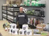 Green Thumb Garden Center owner Nathan Davis pauses behind the counter of the Wasilla store Friday, March 4. The indoor garden center offers a one-stop shop for lighting, nutrients, filters a