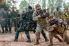 Soldiers from 5th Battalion-20th Infantry Regiment, 1st Stryker Brigade Combat Team, 2nd Infantry Division and the Royal Thai Army conduct the hall clearing phase of a combined military opera