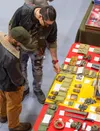 Visitors check the merchandise during the annual Wasilla High Gun Show. J. David McChesney/Frontiersman